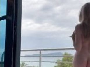 Teen blonde girl tempts neighbors in a hotel on the BALCONY by publicly flashing her body