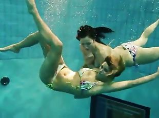 Two sexy amateurs showing off their body under water