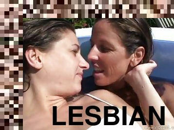 Horny lesbians having sex in the pool