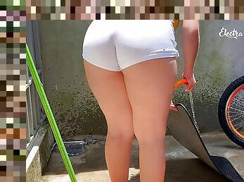 Hot maid in shorts cleaning the rug
