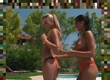 Lesbian fun by the pool with two horny ladies