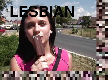 Brunette lesbian teens fuck their tight pussies with a big dildo outdoors