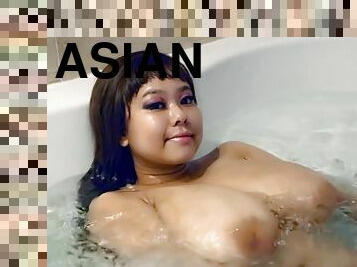 Asian babe with huge melons in the bathtube