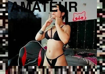 Petite smoking latina rolling her joint and smoking