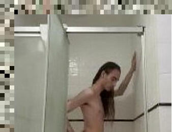 Skinny Long haired guy taking a shower