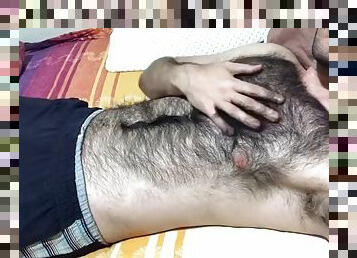 A very hairy man gives a soft dick massage and touches his hairy chest with a big bulge