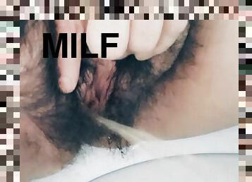 MILF stepmom peeing hairy pussy in bathroom