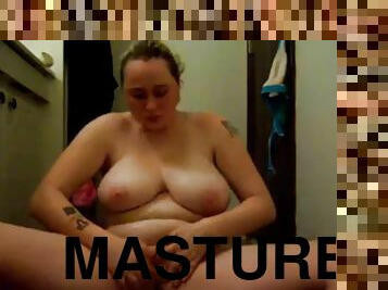 Masturbates with slippery oiled tits