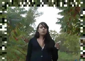 Brunette amateur goes out for a walk in the bushes for a smoke