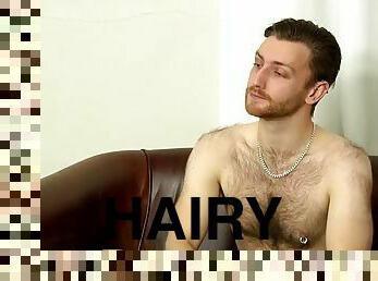 Hairy thug Tristan Stone strokes his big cock solo