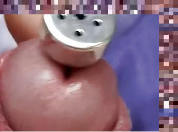 Sounding with a load of cum close-up through a penis plug