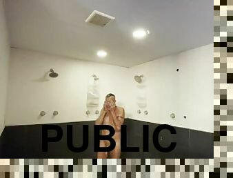 Jacking off in a public campground shower after having a conversation with an employee watching