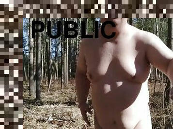 Undressing in a sunny spring forest for my fans