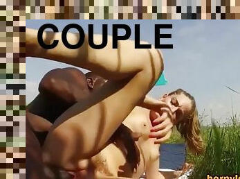 Interracial couple fucking hard outdoors in nature