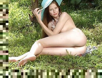 Sexy Teen In A Hat And Dress Poses
