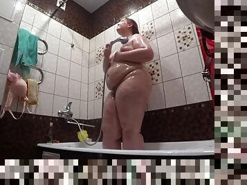 Lesbian has installed a hidden camera in the bathroom at his girlfriend. Peeping behind a bbw with a big ass in the shower. Voyeur.