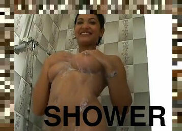 Beautiful girl soaps up in the shower