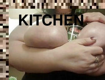 Standing in kitchen oiling tits play