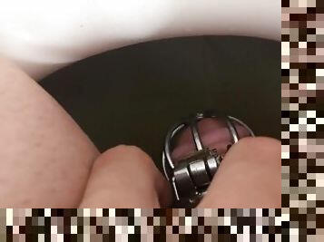 Guy in Chastity Pees in the Toilet