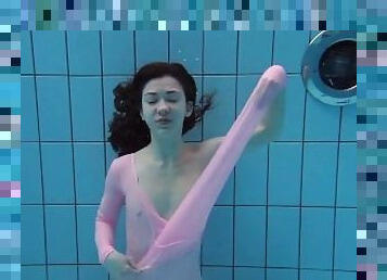 Roxalana Cheh wearing pink dress in the pool