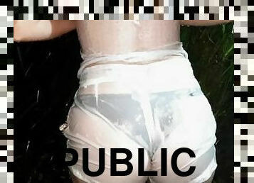 Crazy girl wet in a public park