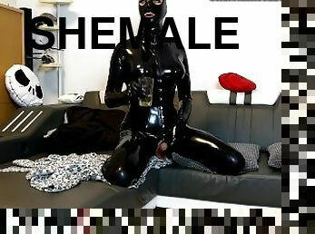 Latex shemale drinking pee / piss