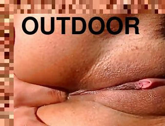 Teen masturbates outdoors in close up scene