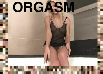 Horny blonde masturbates with a dildo inside a tub