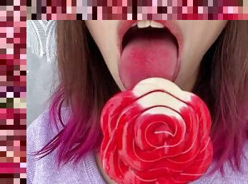 Naughty stepsister sucks a lollipop and show her long hot sexy tongue