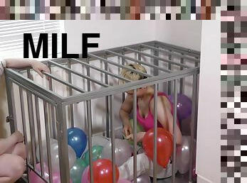 Caged Slave Girl Blows Up Balloons