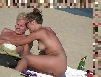 Sexy nudist couple tanning on the beach. Good quality!
