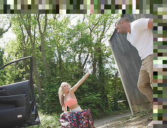 Strong dude gives a sweet blonde a helping dick outdoors