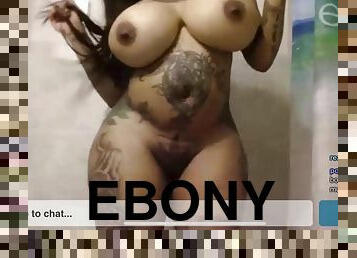 Ebony bitch with massive silicone boobs teasing naked on webcam