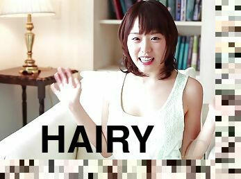 Excited cutie shows off her hairy pussy while reading a book