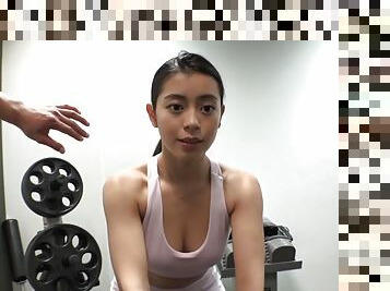 Muscled Asian girl - hardcore workout in gym