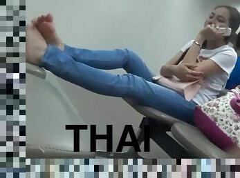Candid feet relaxing thai girl