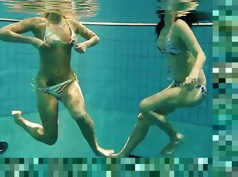 Two sexy amateurs showing off their bodies underwater