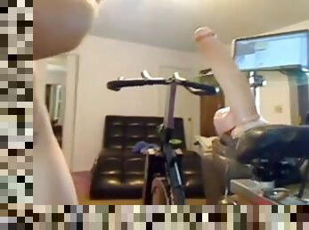 Cam hottie rides a massive dildo while pedaling her bike