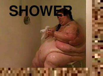 Huge fat chick undresses and takes a shower