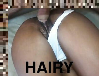 Hairy black pussy gets filled with white cock and warm cream