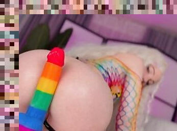 Rainbow slut enjoys a big dildo