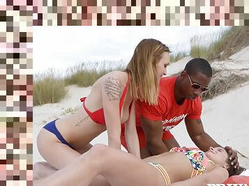Slender sluts have interracial threesome on the beach