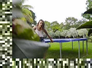 Brunette has some fun on a trampoline with guy