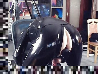 Horny in dark rubber with super plug