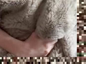 Guy masturbating with a thick faux fur blanket
