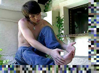 Sexy young Joran is wanking in the garden