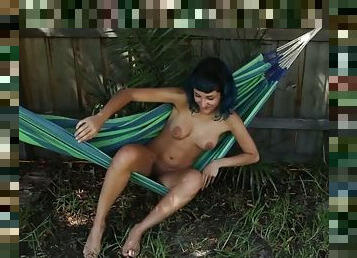 Beautiful all natural babe rubbing her hairy pussy outdoors