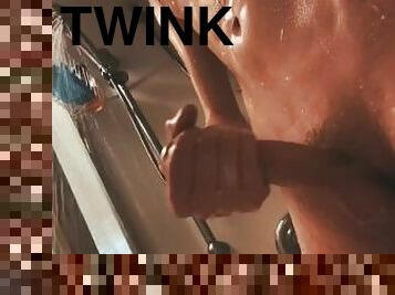 Fit twink jerks off in shower