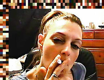 She sensually blows smoke in face