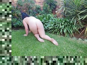 Naked small boobs big ass BBW pissing on a rose tree outside in the garden